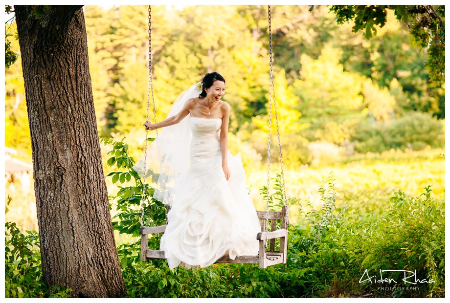 bride on a swing laughing