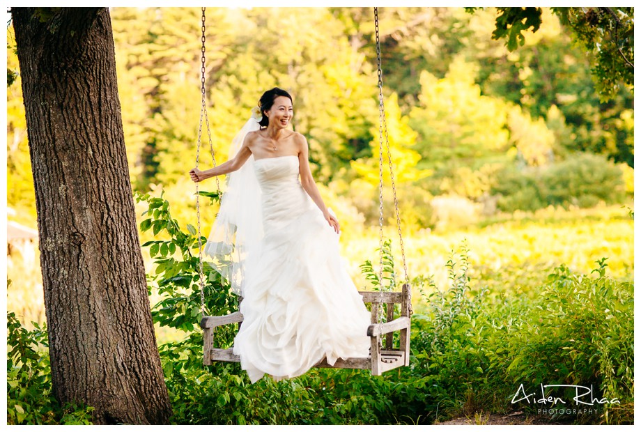 bride on a swing laughing