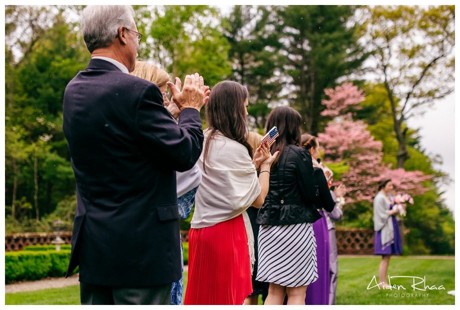 guests clapping outdoor wedding