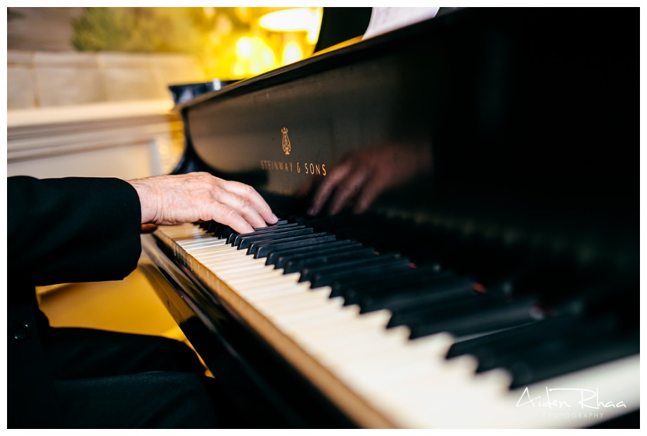musician playing piano for wedding ceremony