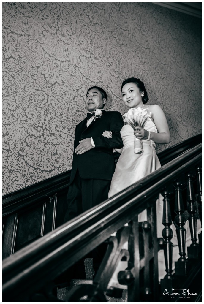 bride and father walking down stairs