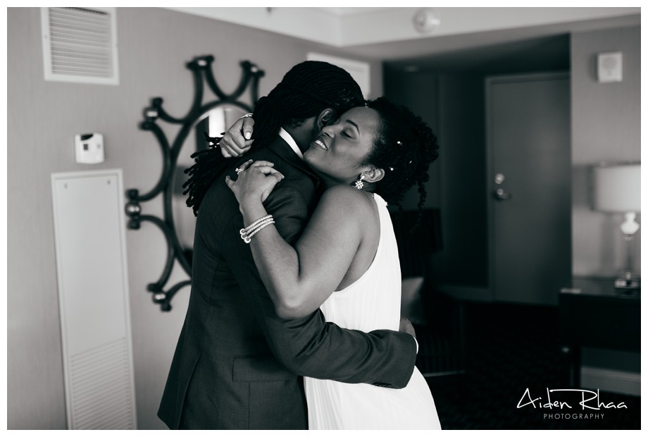 bride groom hugging black and white picture