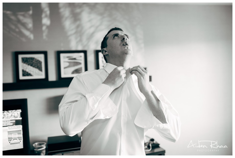 black and white photo groom getting ready